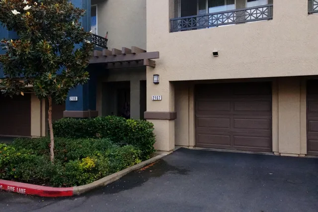 a front view of a house with a garage