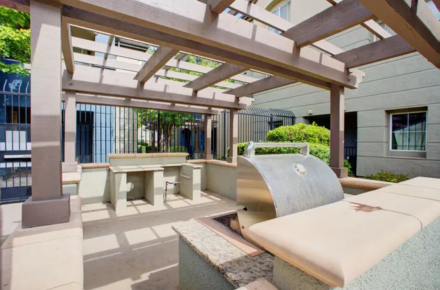 a view of kitchen with a sink and a fireplace