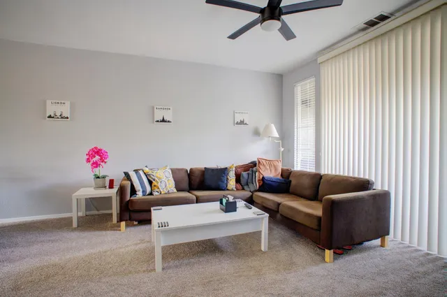 a living room with furniture and a window