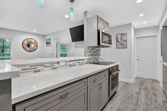 a kitchen with a sink and a stove