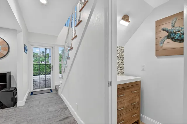a view of entryway with wooden floor and furniture