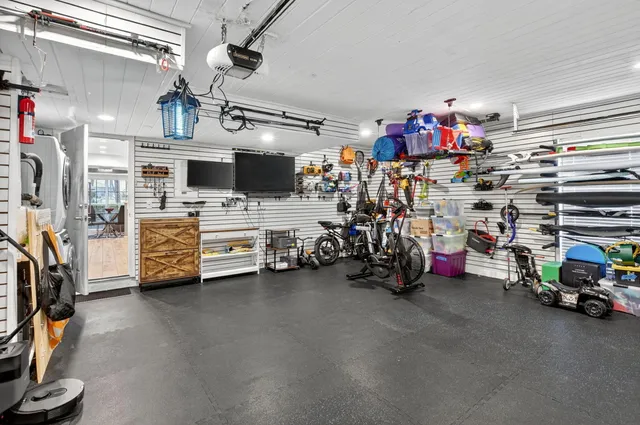 a view of a garage with storage and utility