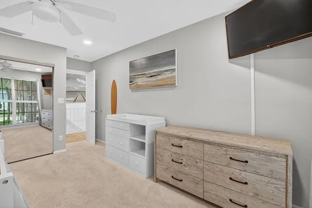 a view of room with cabinet and flat screen tv