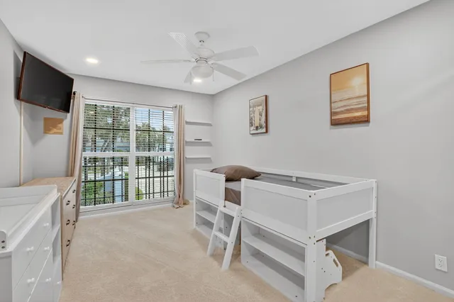 a room with furniture and a flat screen tv