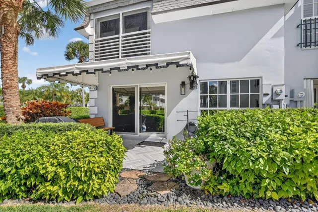 front view of a house with a garden