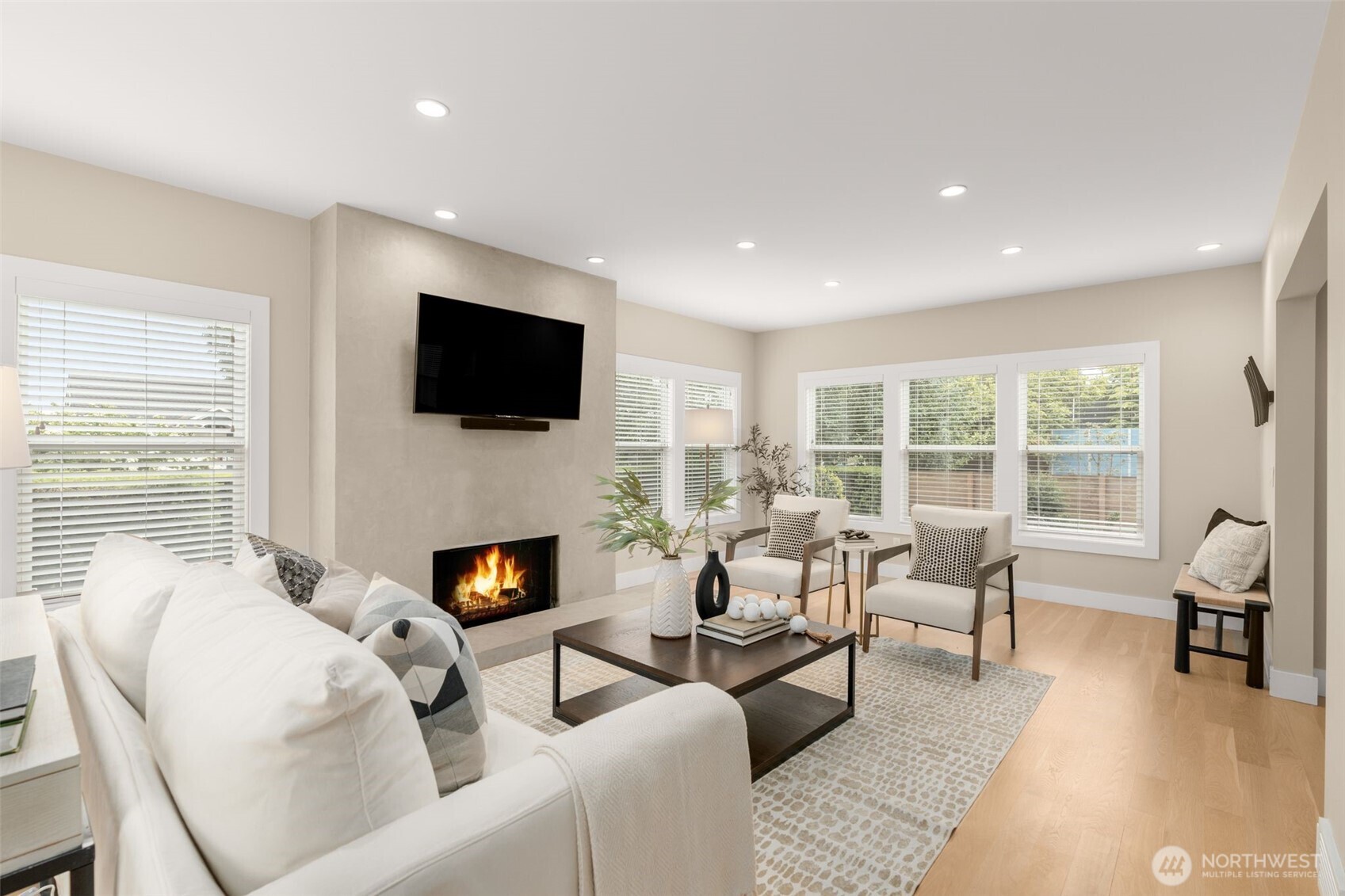 170 Lynn Street Seattle, WA 98109 - Photo 6 of 40 a living room with furniture a fireplace and a flat screen tv