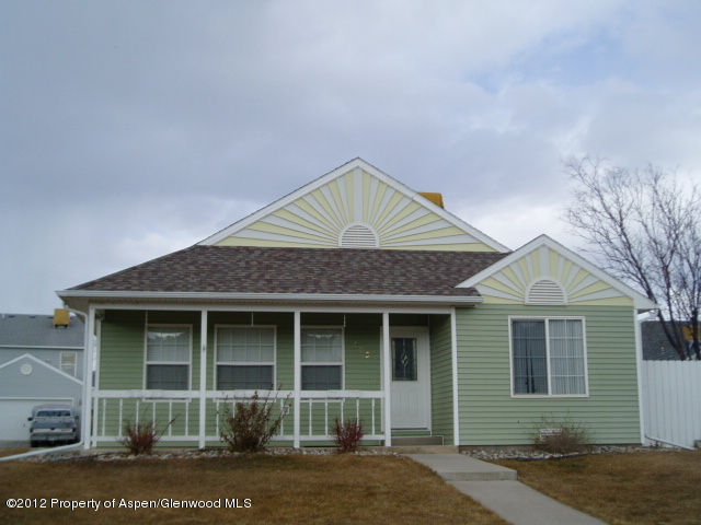402 Evergreen Drive Rifle, CO 81650 - Photo 1 of 13 a front view of a house with garden