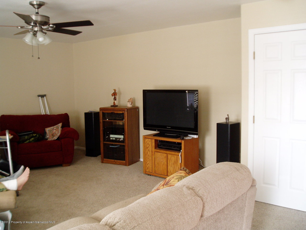 402 Evergreen Drive Rifle, CO 81650 - Photo 3 of 13 a living room with furniture and a flat screen tv