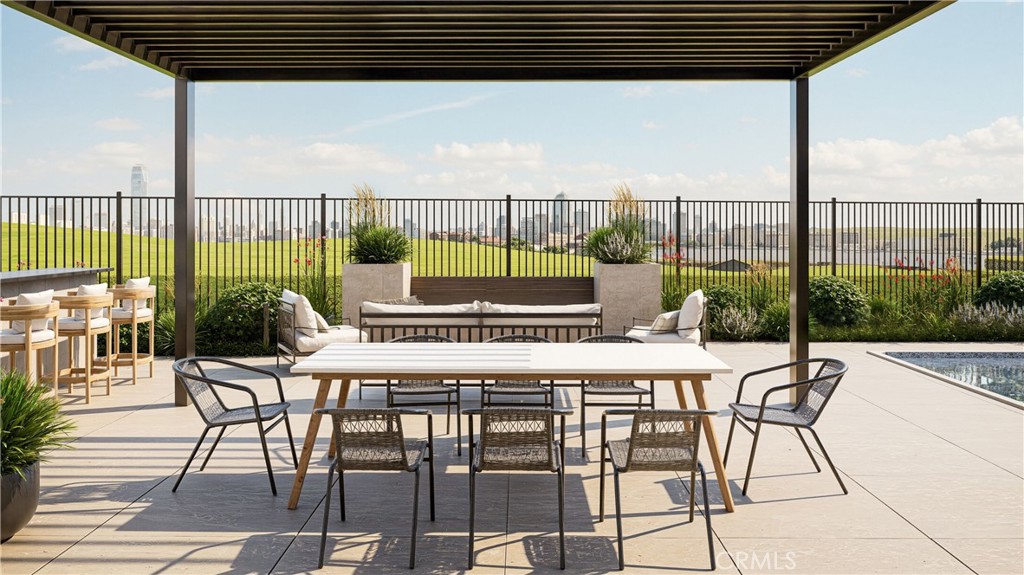 105 Remy Lane Montebello, CA 90640 - Photo 16 of 38 a roof deck with a table and chairs