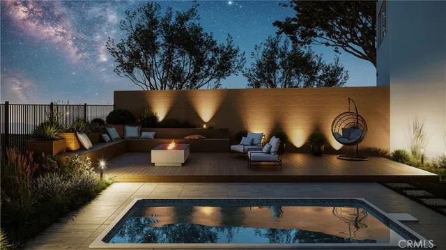 a living room with fireplace furniture and a potted plant