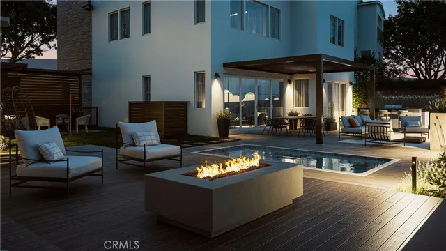 a view of a patio with couches table and chairs and potted plants