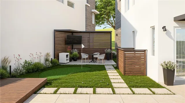 a view of a backyard with sitting area
