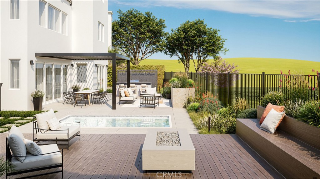 105 Remy Lane Montebello, CA 90640 - Photo 9 of 38 a view of a patio with couches chairs potted plants and water view