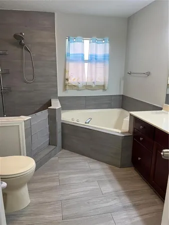 a bathroom with a bathtub sink and toilet