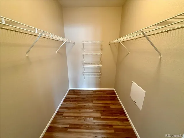 a bathroom with a sink double vanity granite tub shower and a mirror
