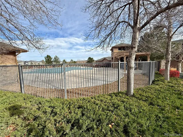 a living room with furniture a large window and a flat screen tv