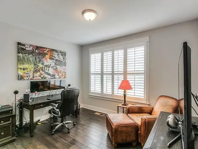 a workspace with furniture and a window