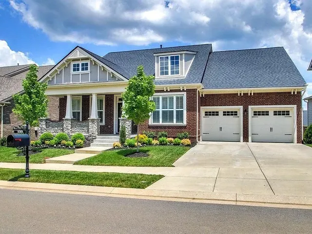front view of a house with a yard