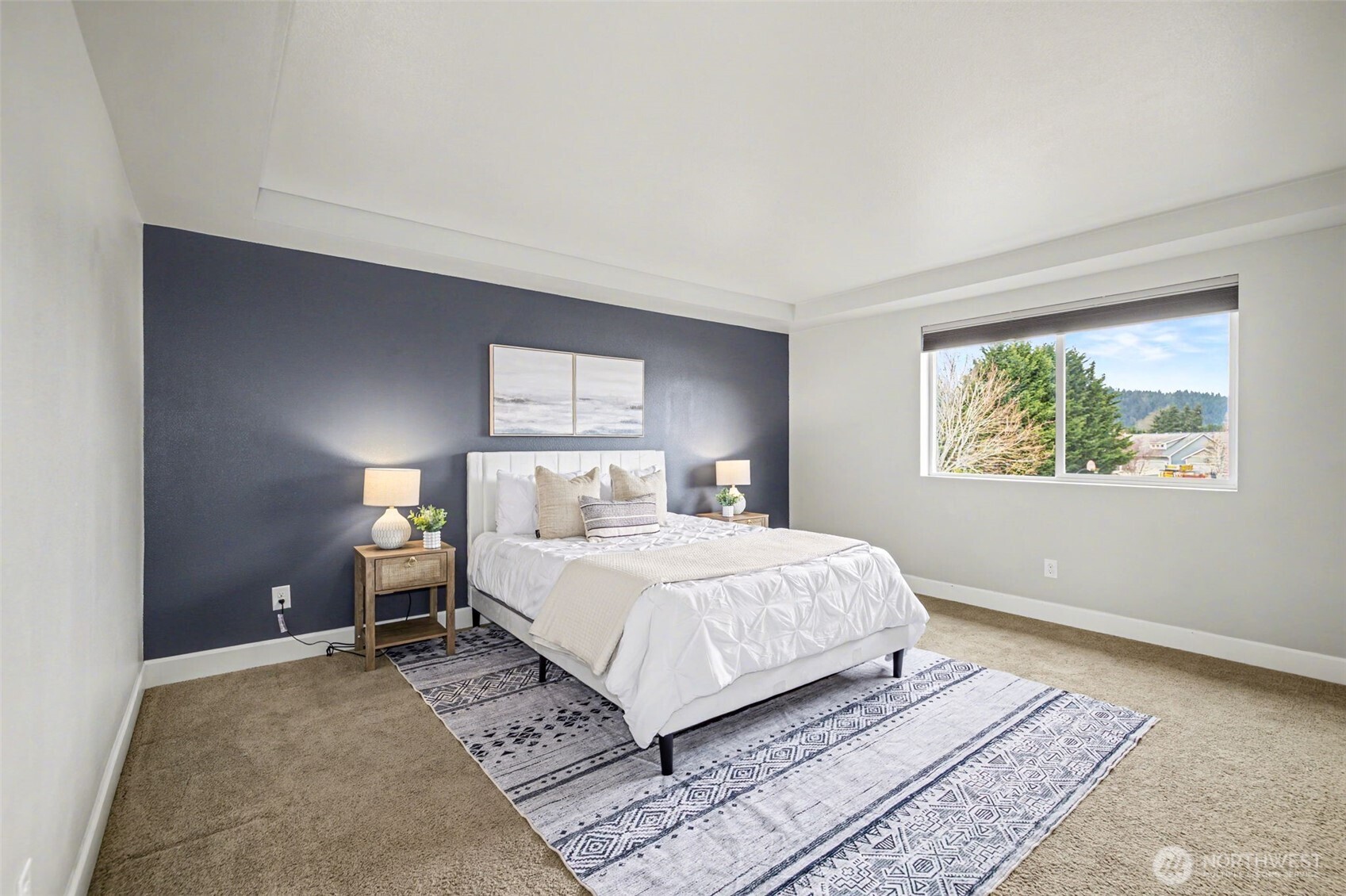 207 Fielding Street Northeast Orting, WA 98360 - Photo 16 of 37 a bedroom with a large bed and a window