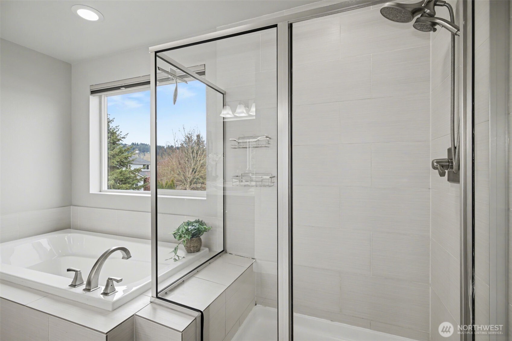 207 Fielding Street Northeast Orting, WA 98360 - Photo 19 of 37 a bathroom with a tub and a shower