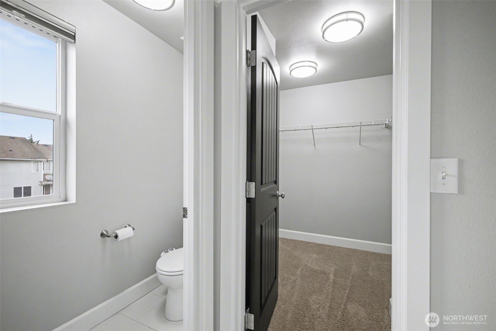 207 Fielding Street Northeast Orting, WA 98360 - Photo 20 of 37 a bathroom with a granite countertop toilet and a shower