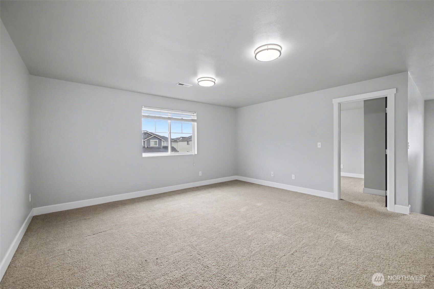 207 Fielding Street Northeast Orting, WA 98360 - Photo 22 of 37 a view of an empty room with a window