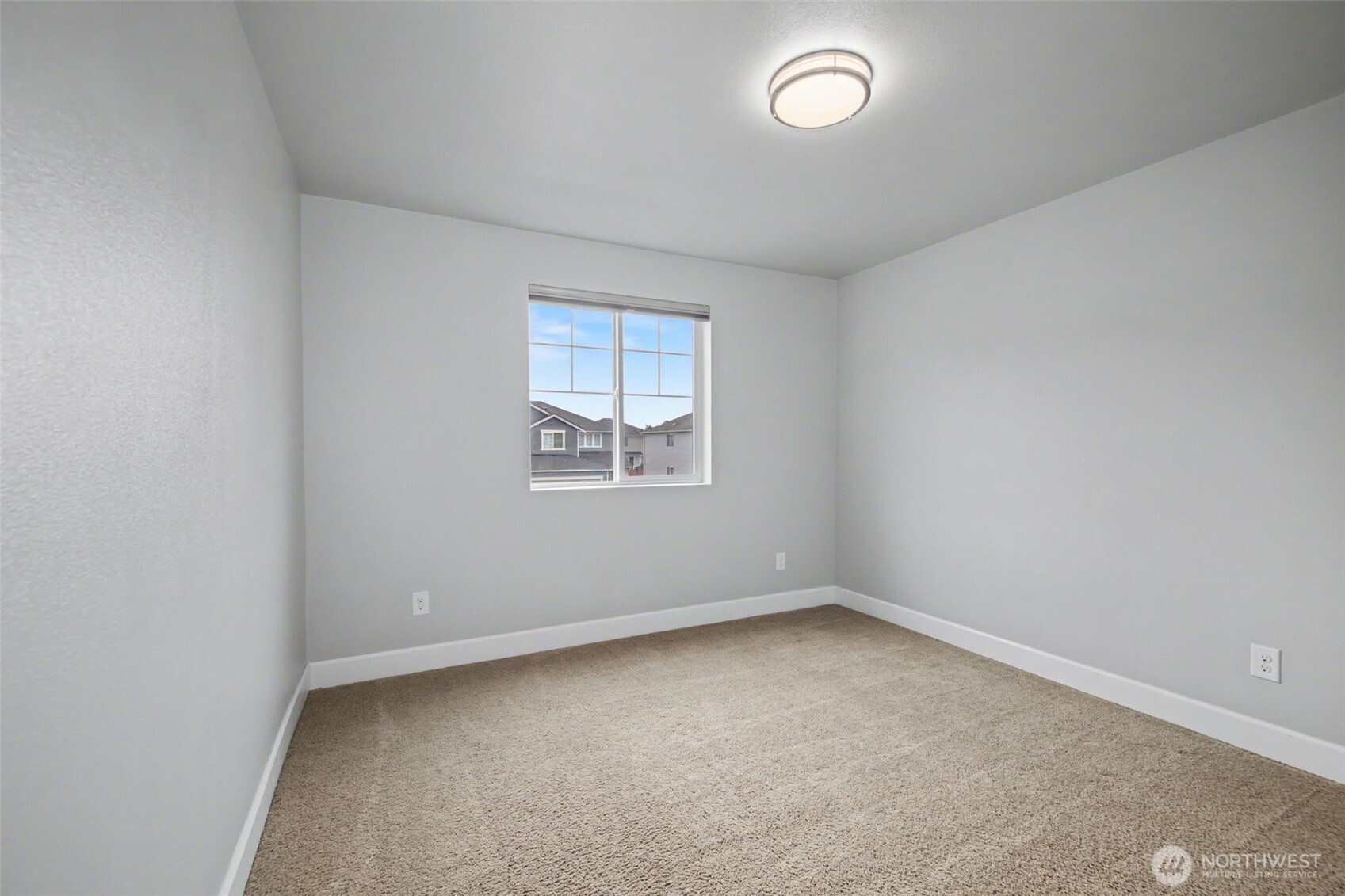 207 Fielding Street Northeast Orting, WA 98360 - Photo 25 of 37 an empty room with a window