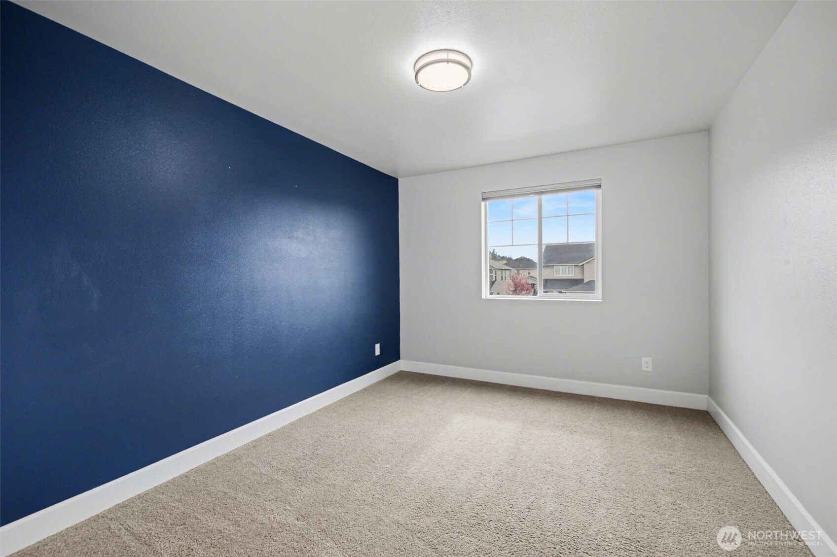 207 Fielding Street Northeast Orting, WA 98360 - Photo 27 of 37 an empty room with a window