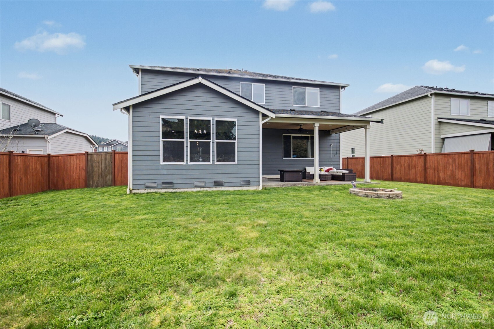 207 Fielding Street Northeast Orting, WA 98360 - Photo 30 of 37 a front view of house with yard and green space
