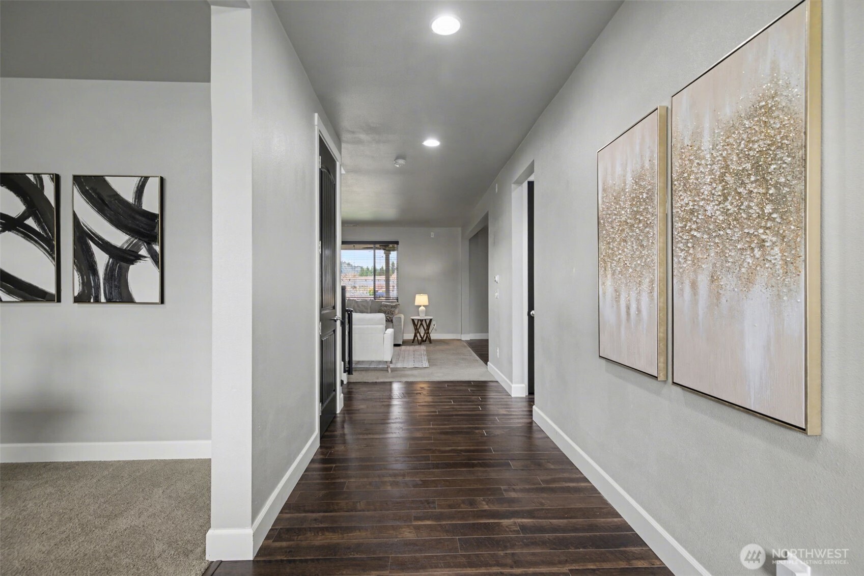 207 Fielding Street Northeast Orting, WA 98360 - Photo 3 of 37 a view of a hallway with wooden floor and staircase