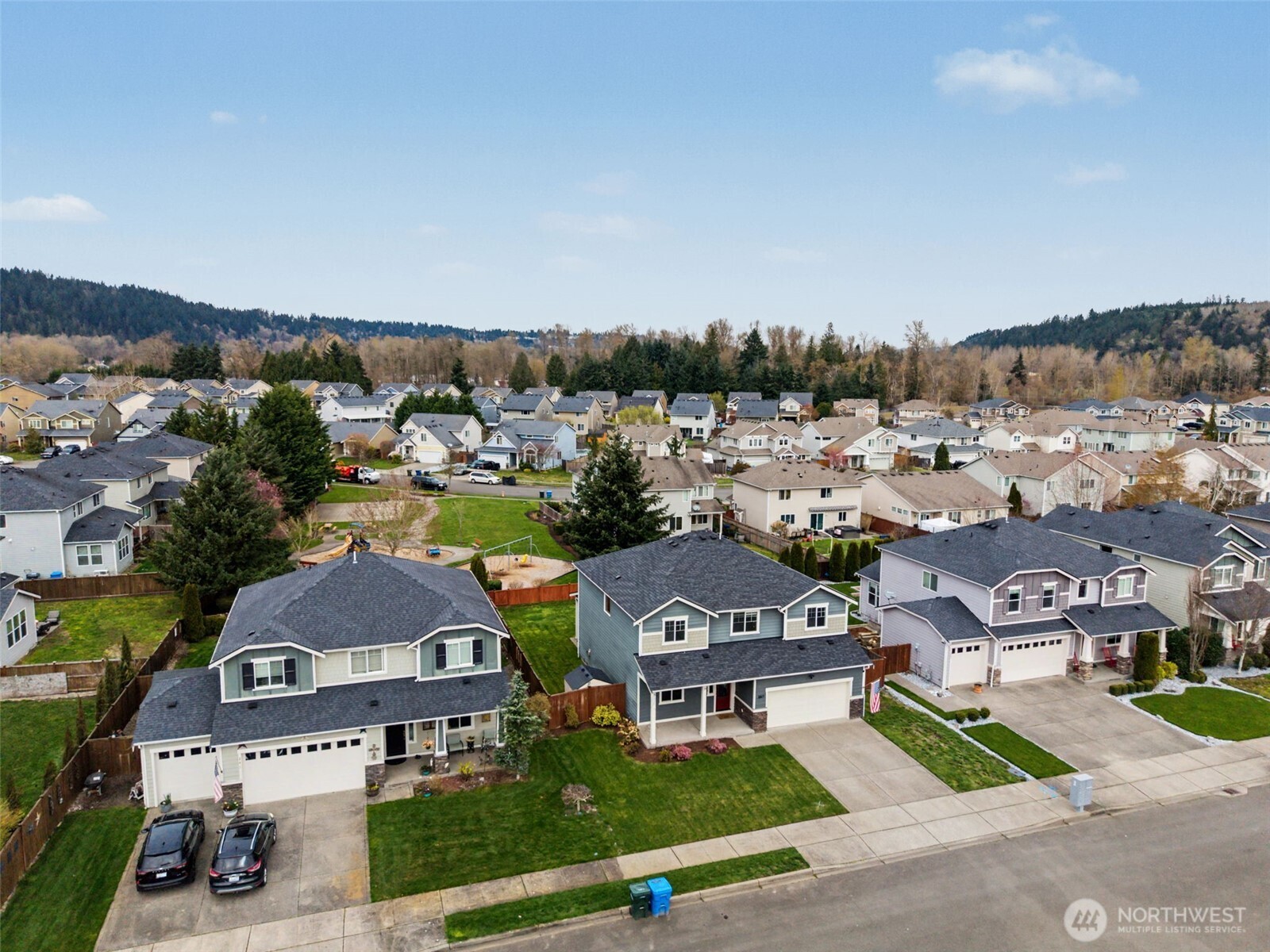 207 Fielding Street Northeast Orting, WA 98360 - Photo 36 of 37 an aerial view of residential houses with outdoor space
