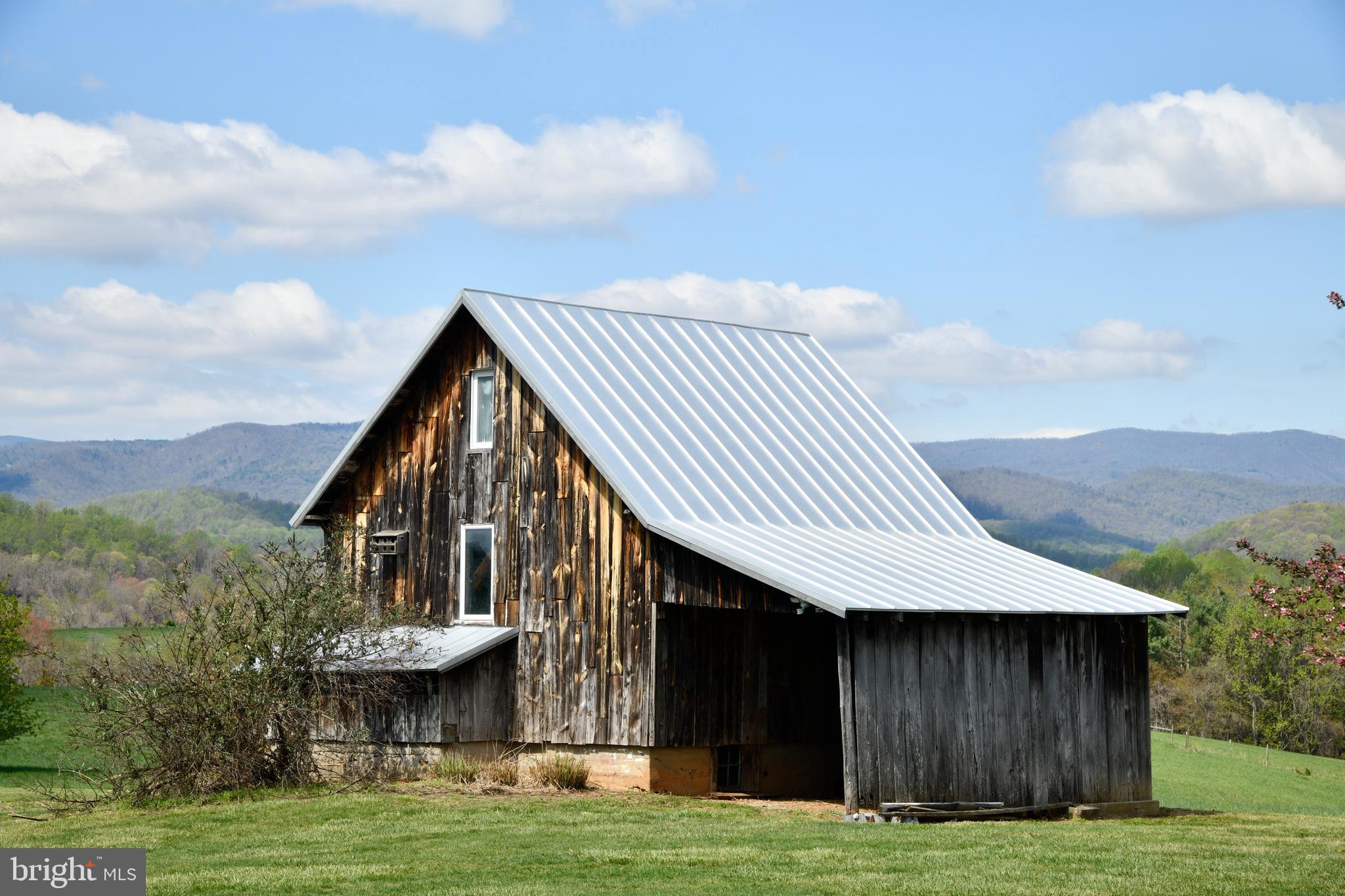 873 Hawlin Road Woodville, VA 22749 - Photo 13 of 45 a view of a house with a yard