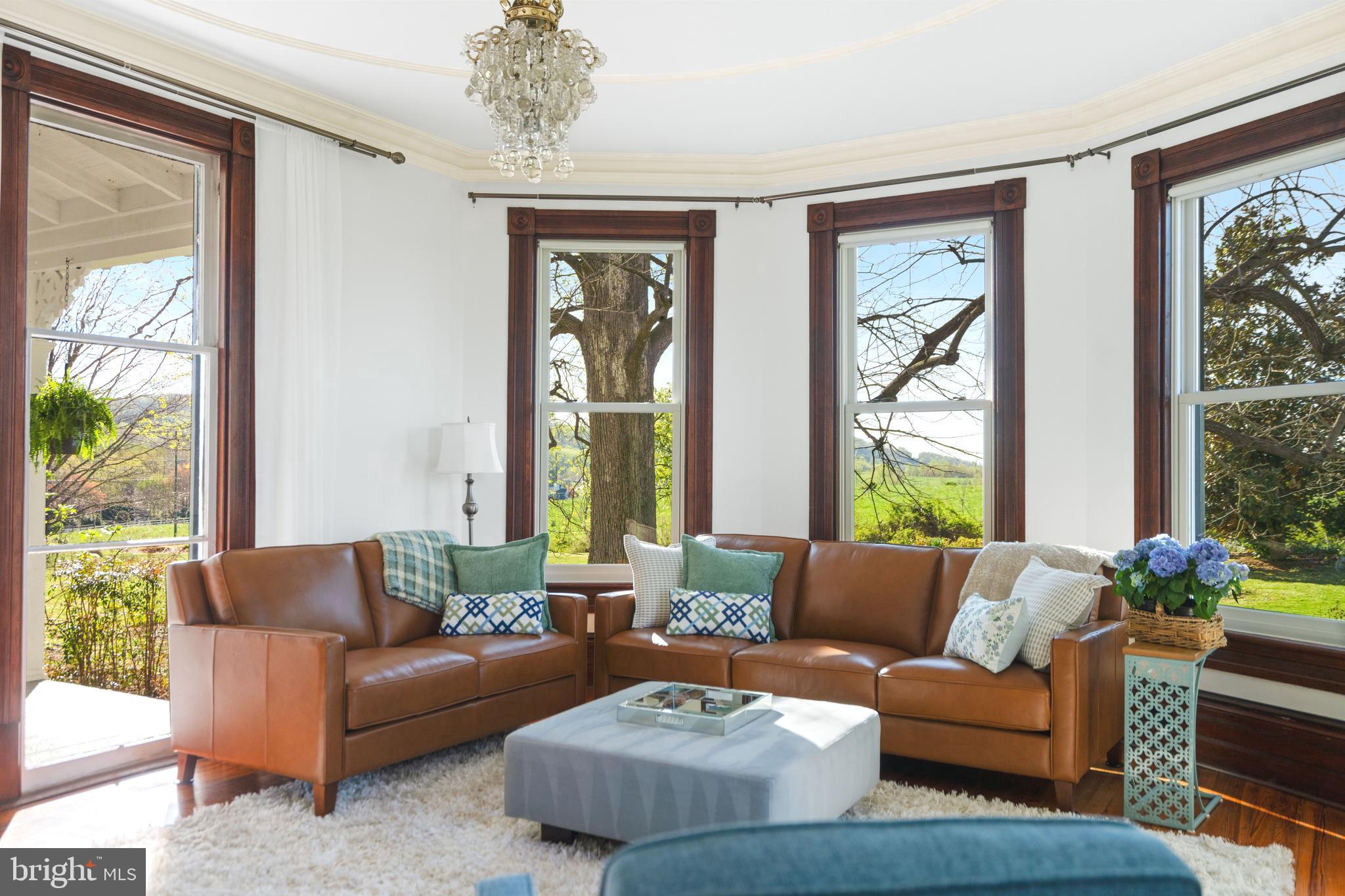 873 Hawlin Road Woodville, VA 22749 - Photo 18 of 45 a living room with furniture and a large window