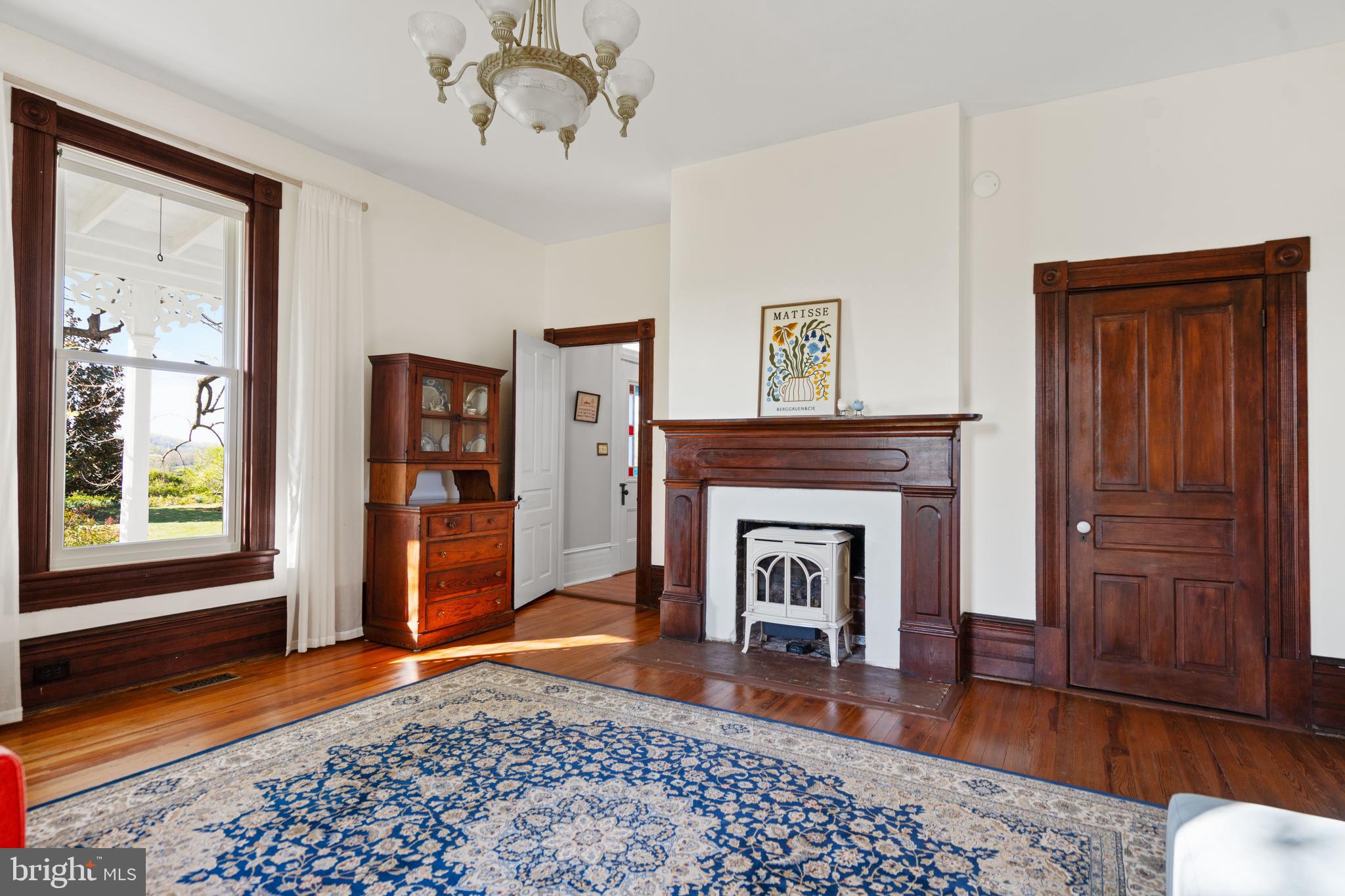 873 Hawlin Road Woodville, VA 22749 - Photo 19 of 45 a living room with furniture and a fireplace