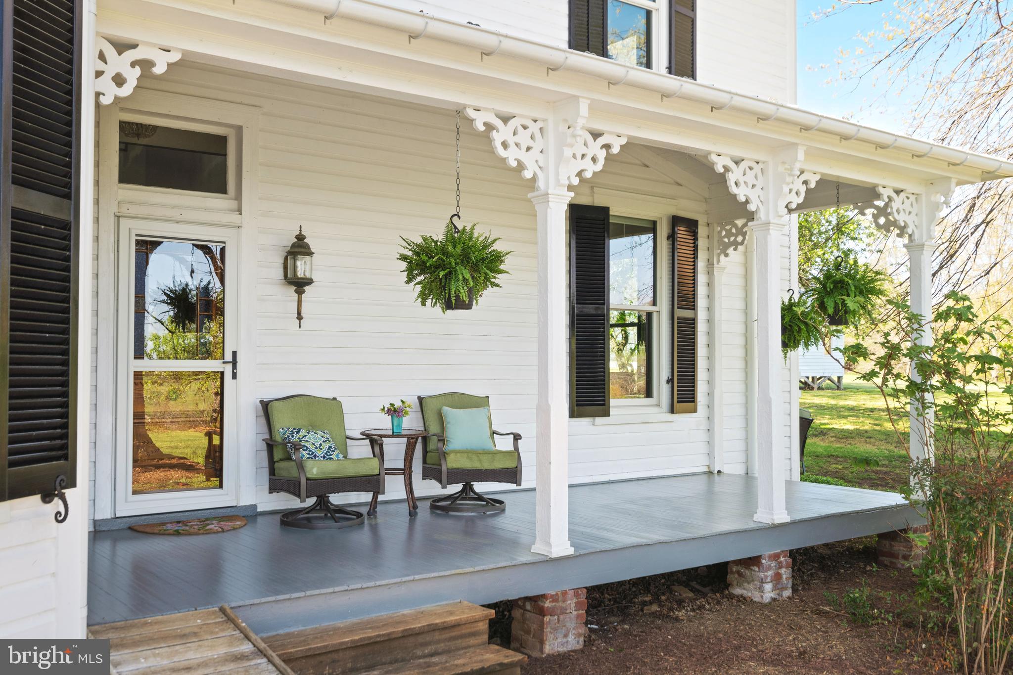 873 Hawlin Road Woodville, VA 22749 - Photo 2 of 45 a view of front door and deck with furniture