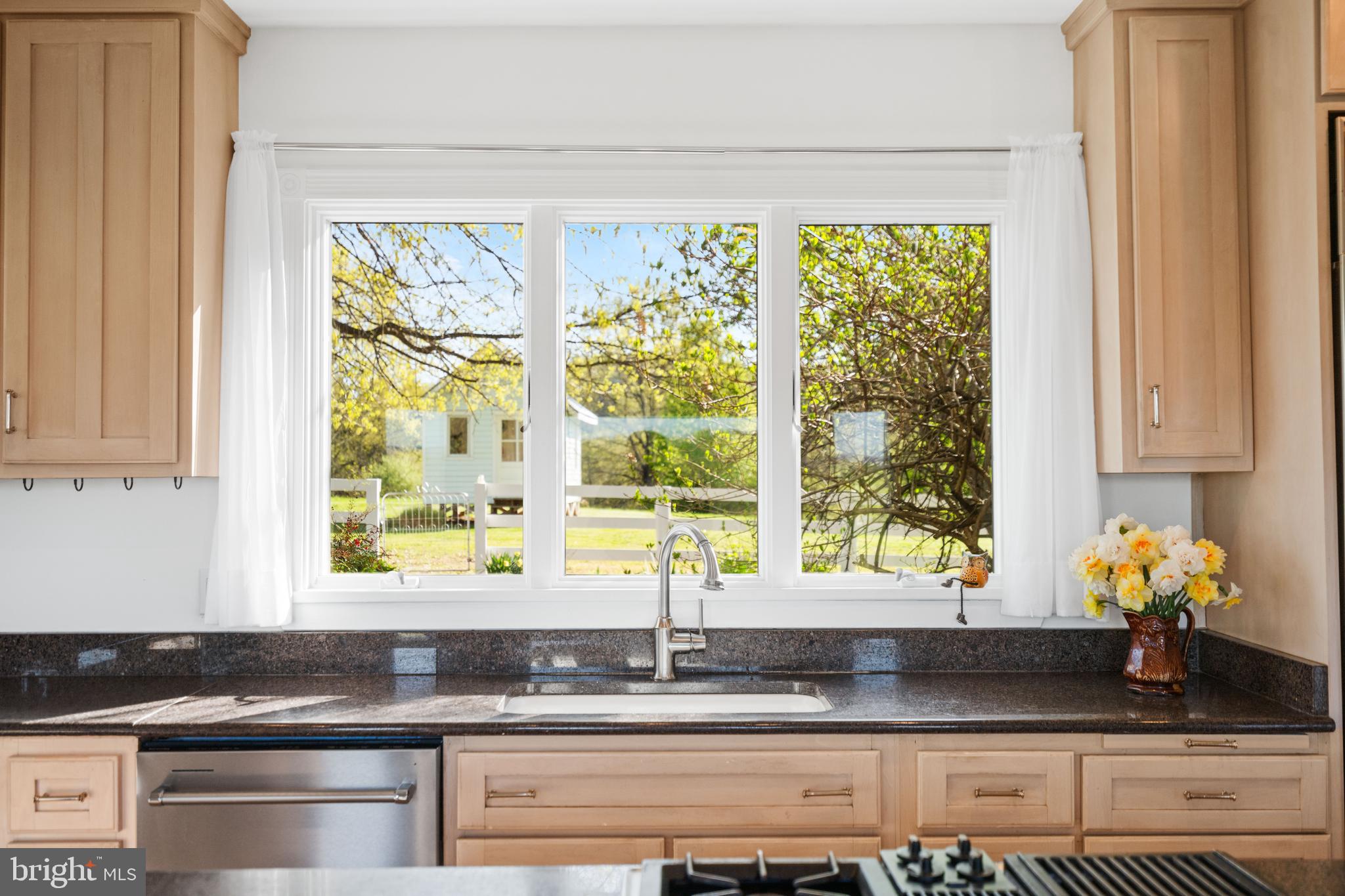 873 Hawlin Road Woodville, VA 22749 - Photo 22 of 45 a kitchen with granite countertop a window and a counter space