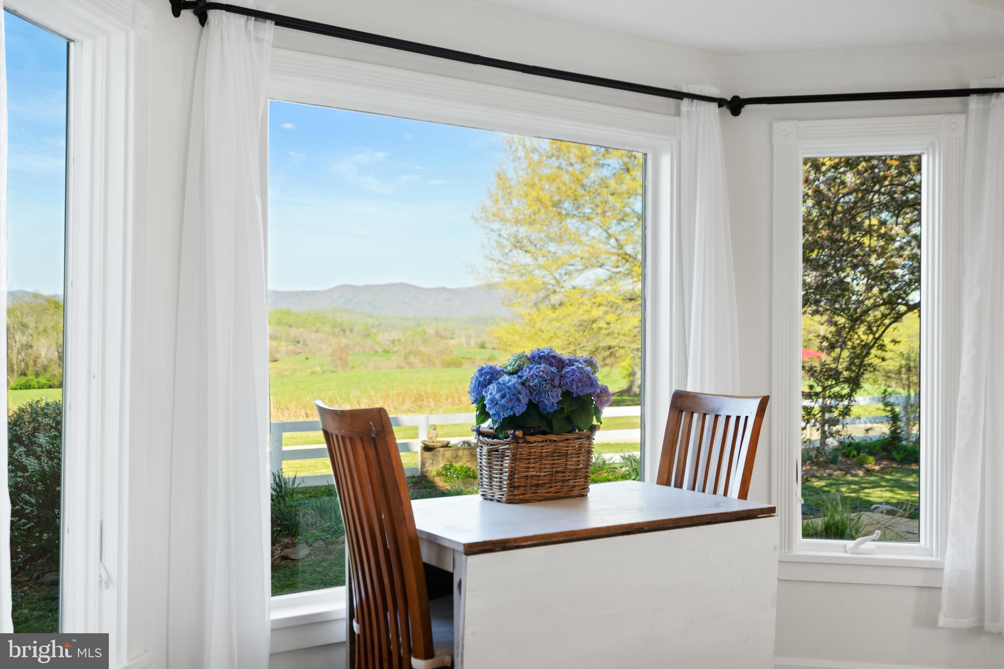 873 Hawlin Road Woodville, VA 22749 - Photo 23 of 45 a view of a dining room with furniture window and outside view