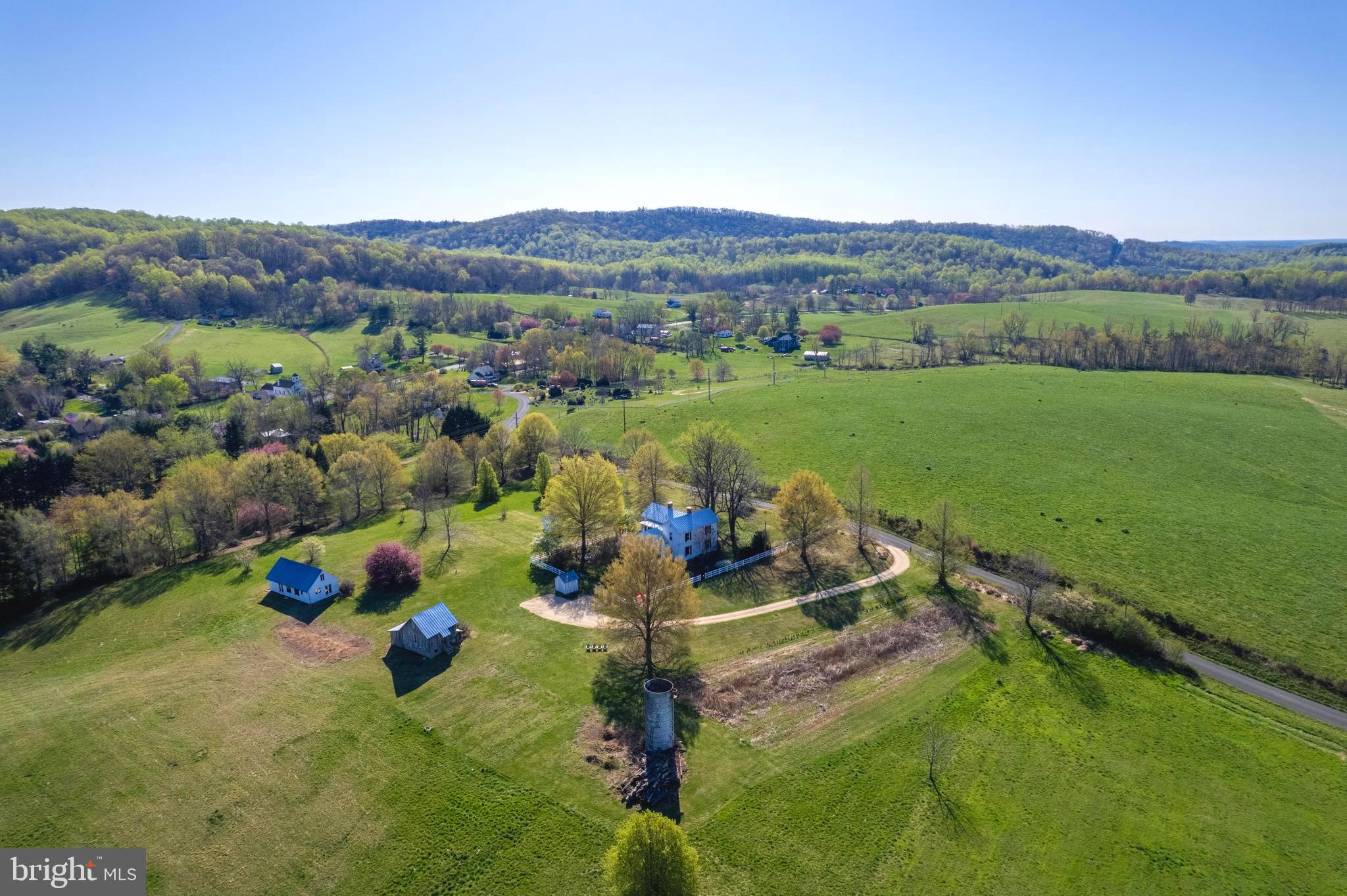 873 Hawlin Road Woodville, VA 22749 - Photo 3 of 45 a view of a lake with a mountain in the background