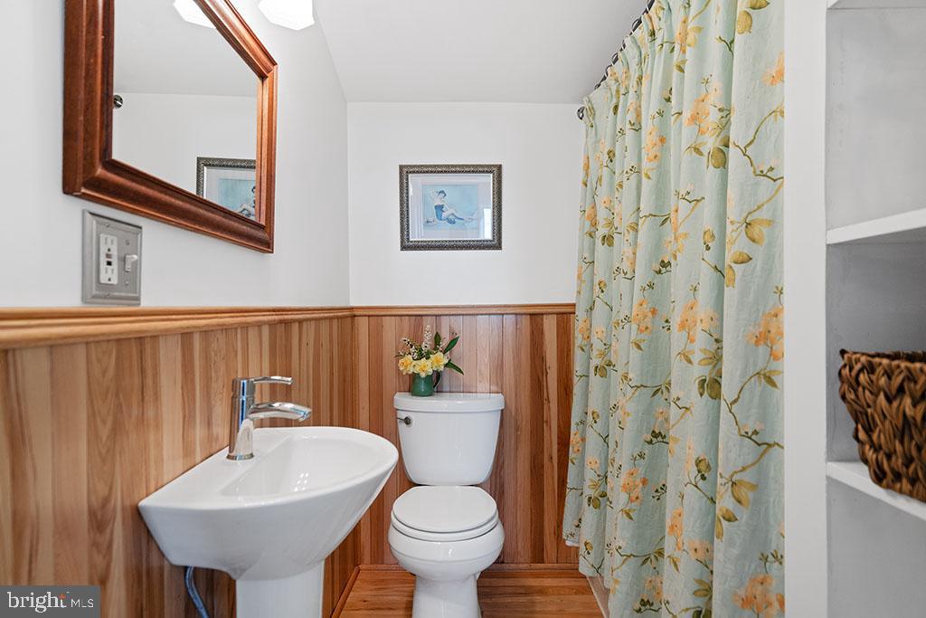 873 Hawlin Road Woodville, VA 22749 - Photo 31 of 45 a bathroom with a sink toilet and a mirror