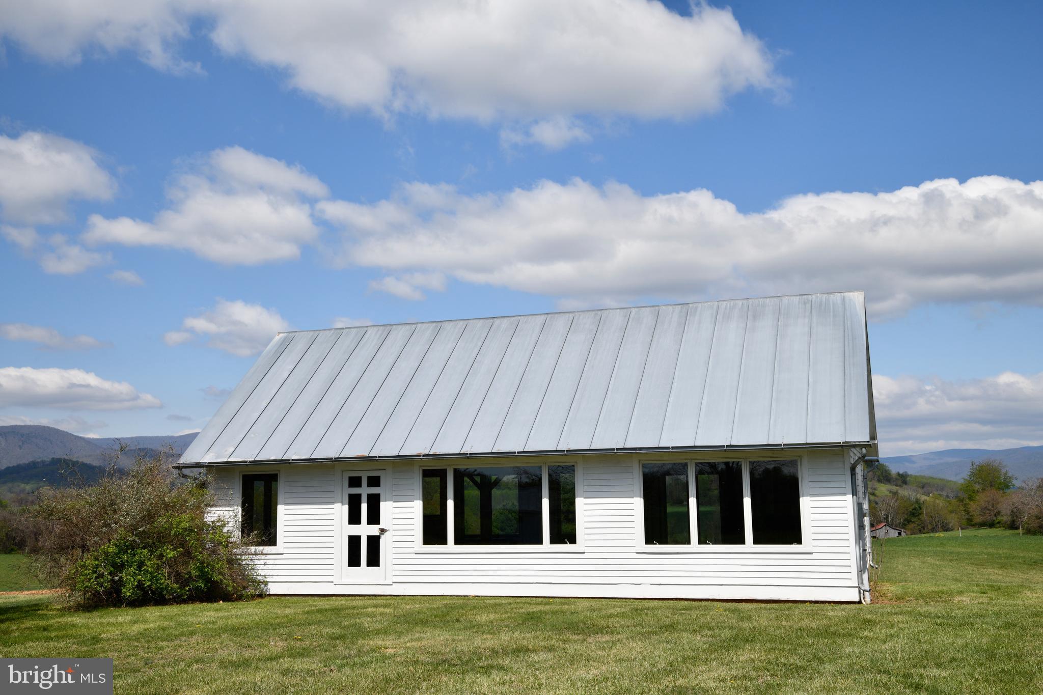 873 Hawlin Road Woodville, VA 22749 - Photo 34 of 45 a front view of a house with a garden