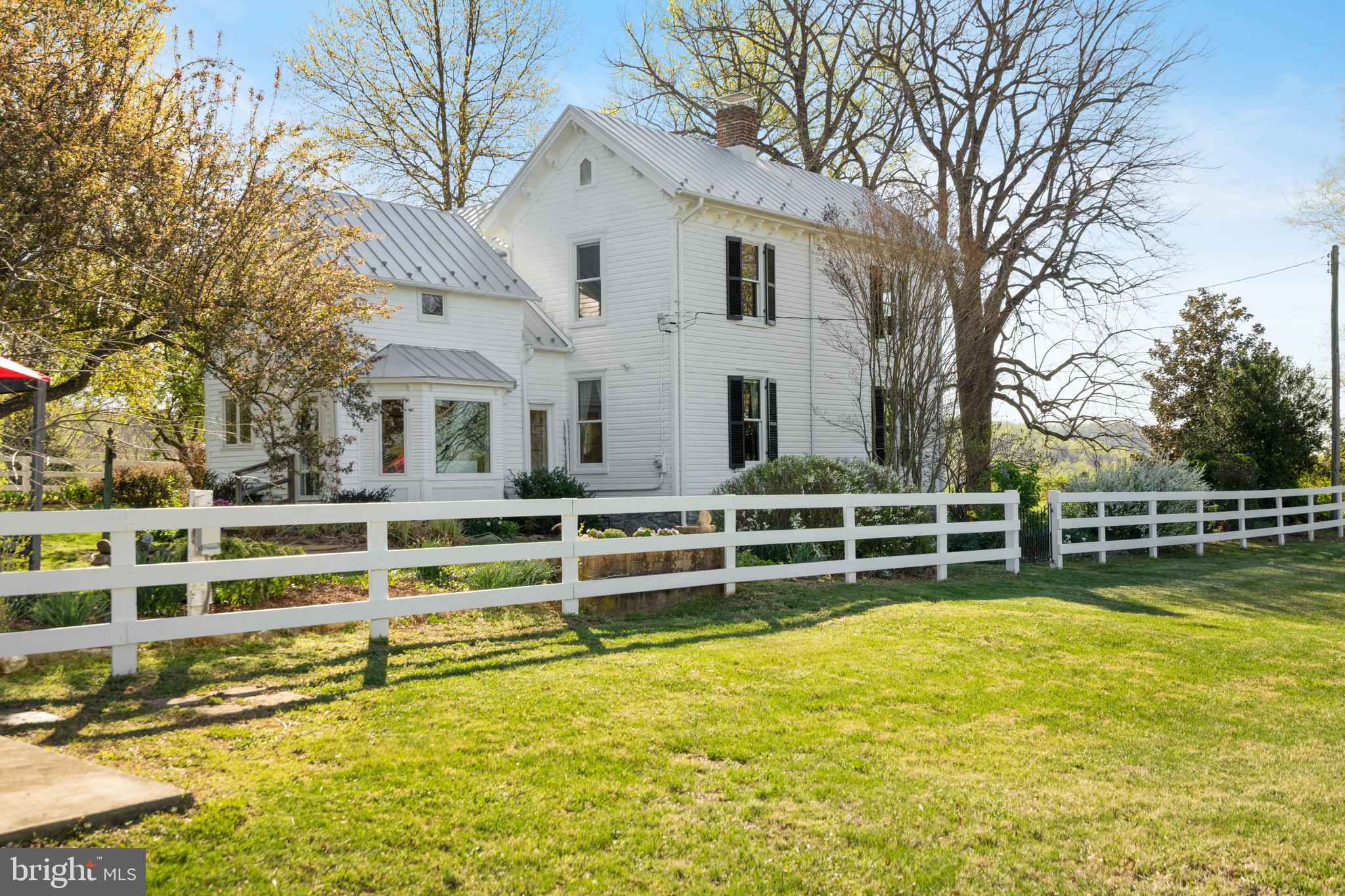 873 Hawlin Road Woodville, VA 22749 - Photo 6 of 45 a view of a swimming pool with a bench and trees around