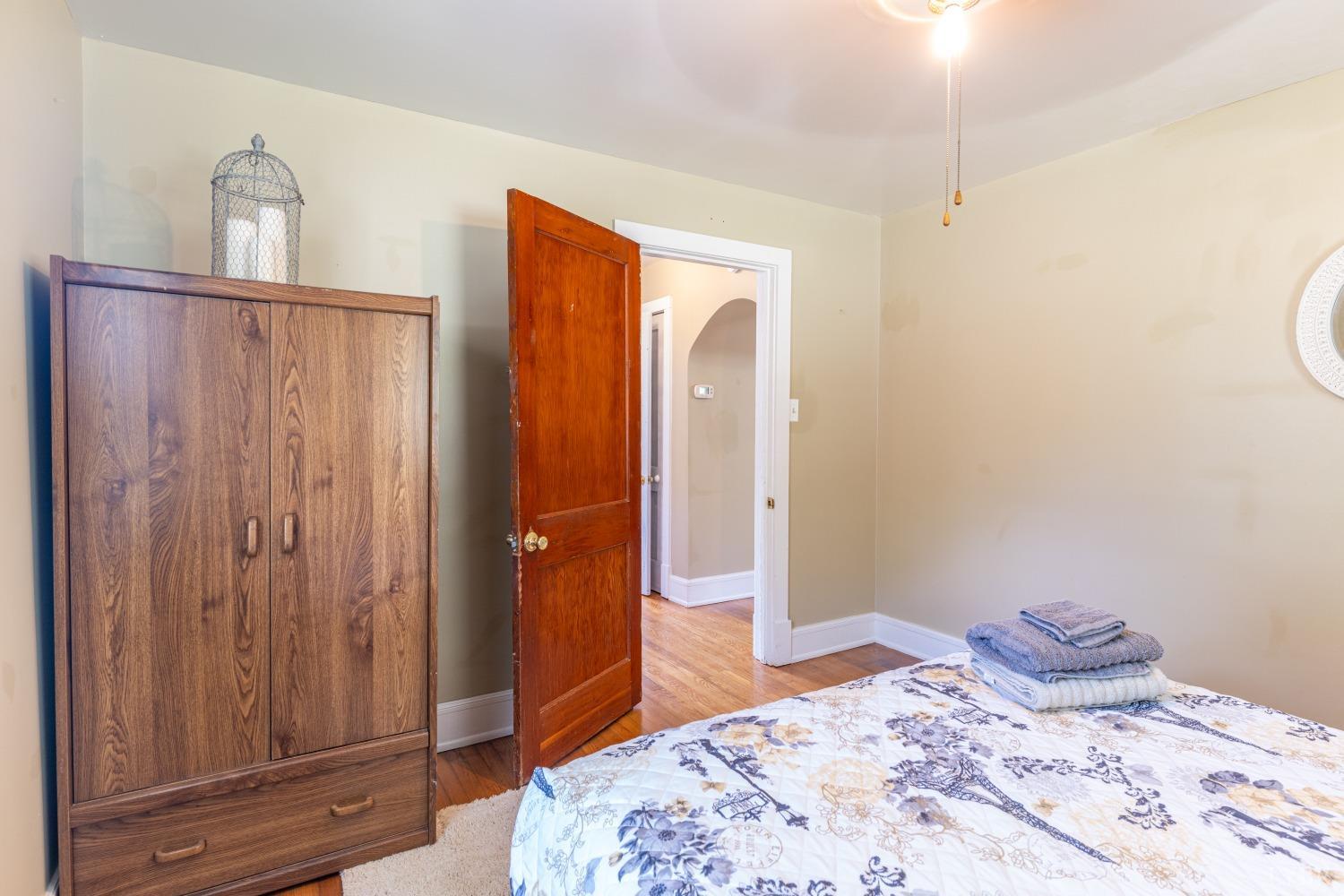 3676 Depot Road Rustburg, VA 24588 - Photo 15 of 37 a bedroom with a bed and wooden floor