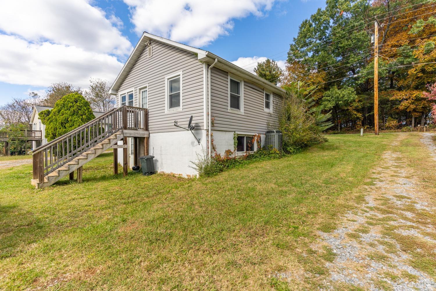 3676 Depot Road Rustburg, VA 24588 - Photo 20 of 37 a view of a house with a yard and sitting area