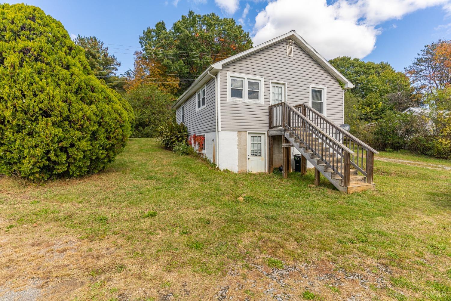 3676 Depot Road Rustburg, VA 24588 - Photo 21 of 37 a view of a house with a yard