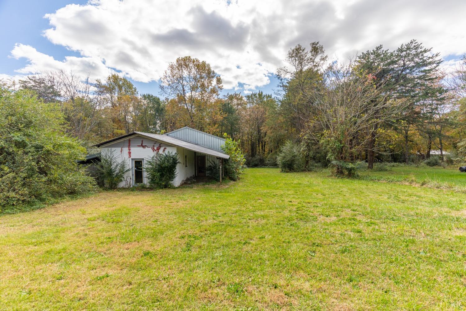 3676 Depot Road Rustburg, VA 24588 - Photo 22 of 37 a view of a large garden with plants and large trees