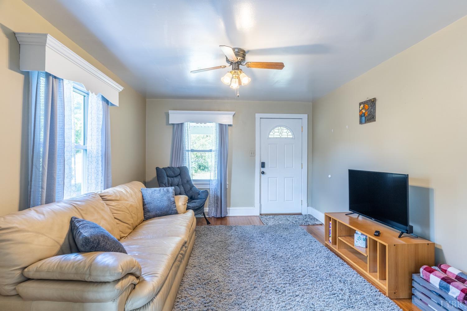3676 Depot Road Rustburg, VA 24588 - Photo 5 of 37 a living room with furniture and a flat screen tv