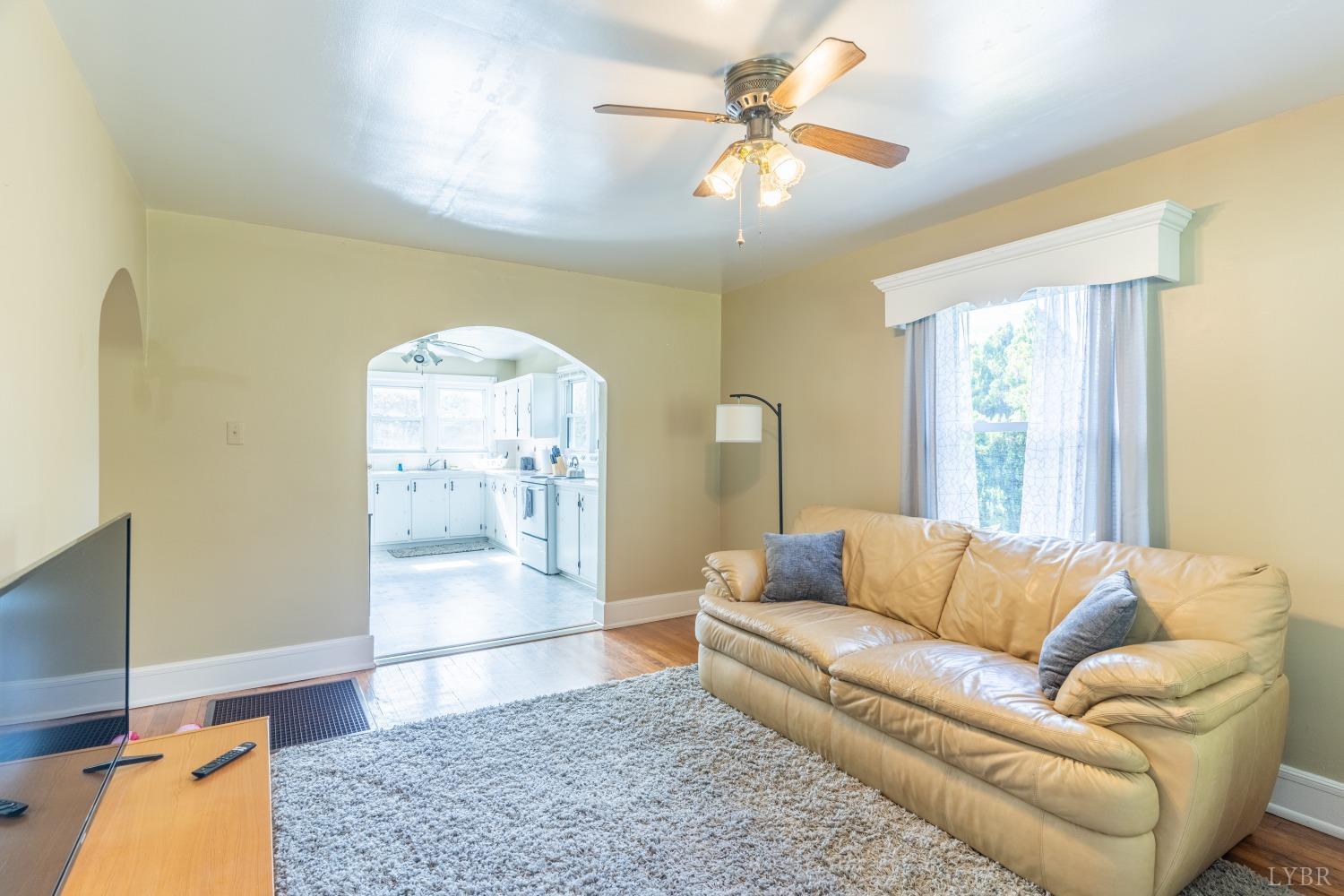 3676 Depot Road Rustburg, VA 24588 - Photo 6 of 37 a living room with furniture and a chandelier