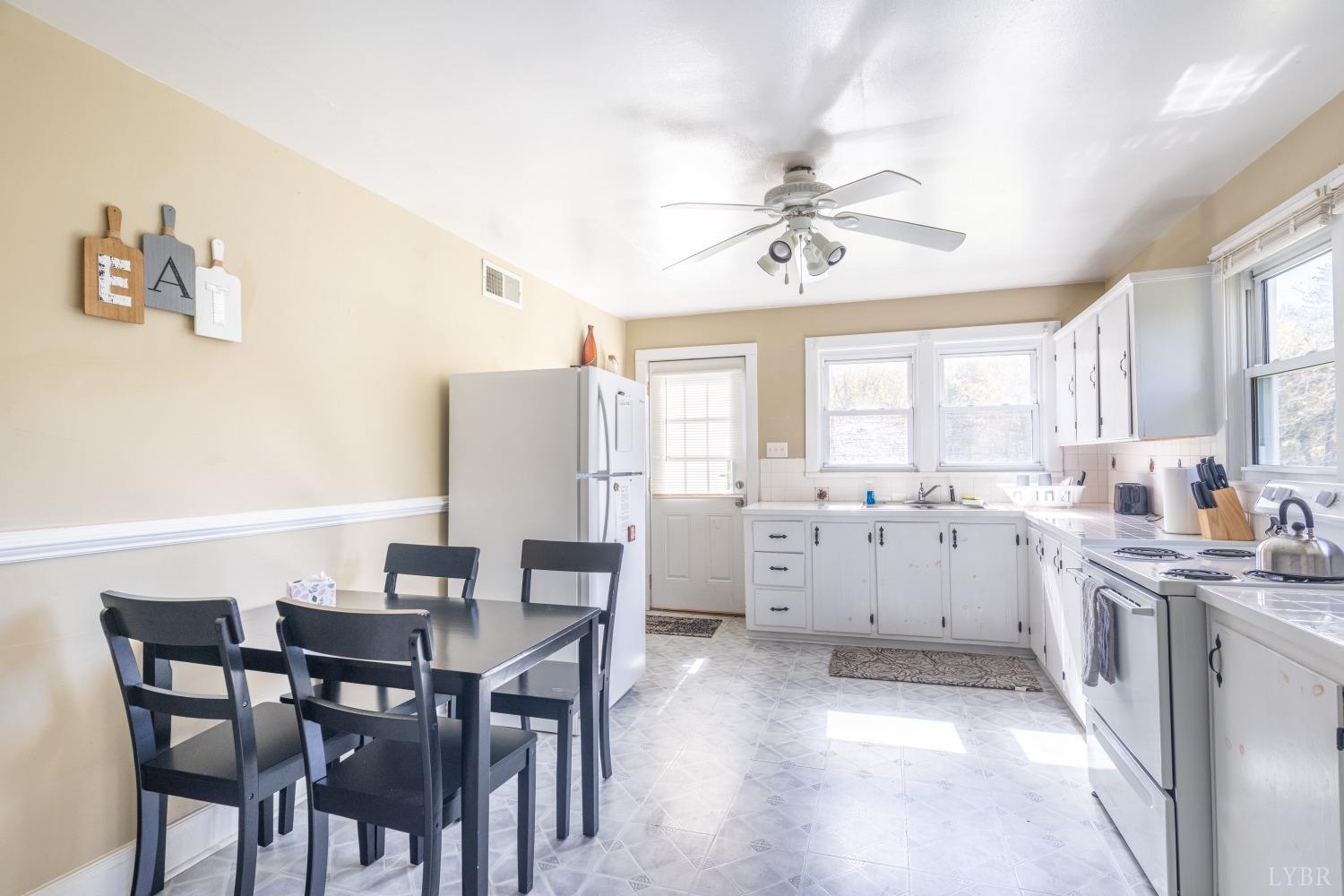 3676 Depot Road Rustburg, VA 24588 - Photo 8 of 37 a view of a dining room with furniture and window