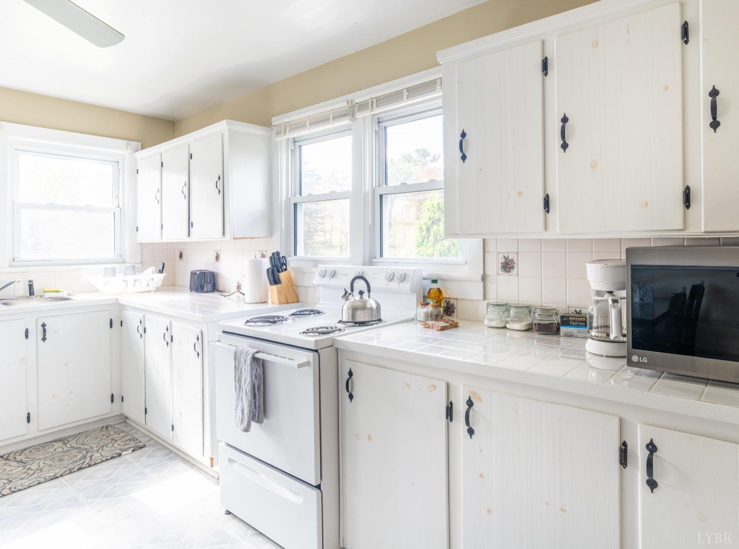 3676 Depot Road Rustburg, VA 24588 - Photo 9 of 37 a kitchen with appliances cabinets and a sink