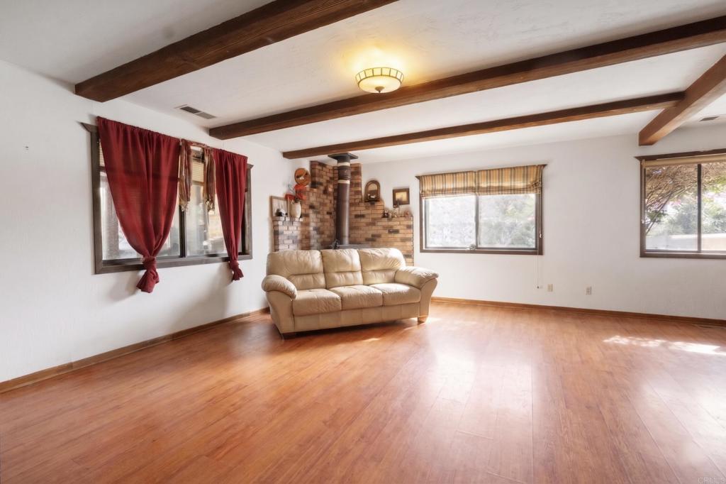 823 Rice Canyon Road Fallbrook, CA 92028 - Photo 8 of 30 a living room with furniture and a large window